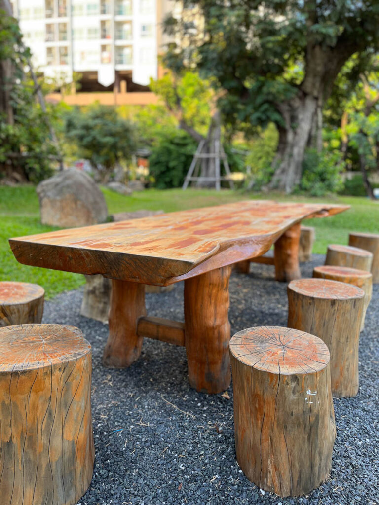 Handcrafted wooden furniture in Vaanaa's garden area