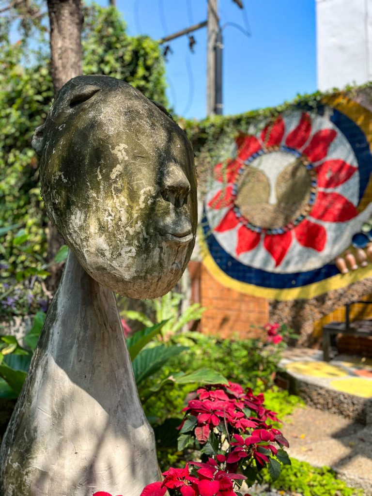 Dappled sunlight and quirky artistic charm in Caramellow's enchanting garden