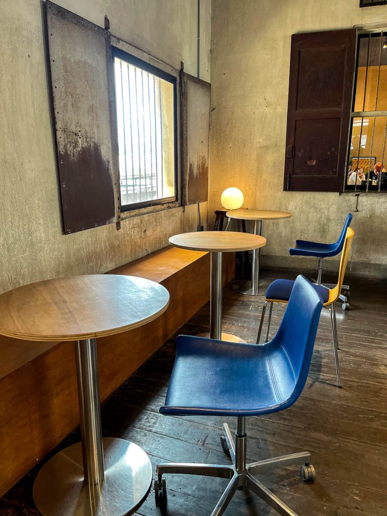 A playful mix of curved tables, stools, and chairs add to the charm of Building A