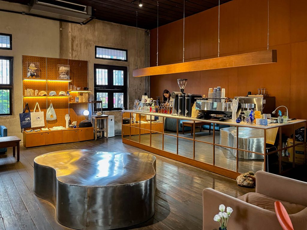 Inside Building A, a mirrored bar anchors the space where past meets present