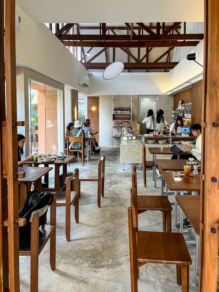 The interior of KLAY, Chiang Mai: simple seating, natural light, and calming earth tones
