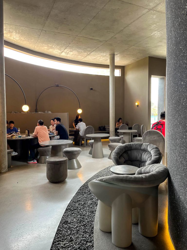 Curves, concrete, and calm—PLUTO’s otherworldly interior