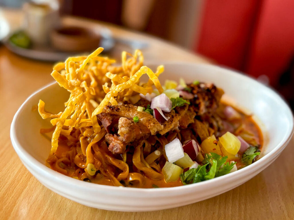 Where home-cooked Thai favourites meet cafe comfort — Haus 224's flavour-packed Khao Soi with Crispy Chicken
