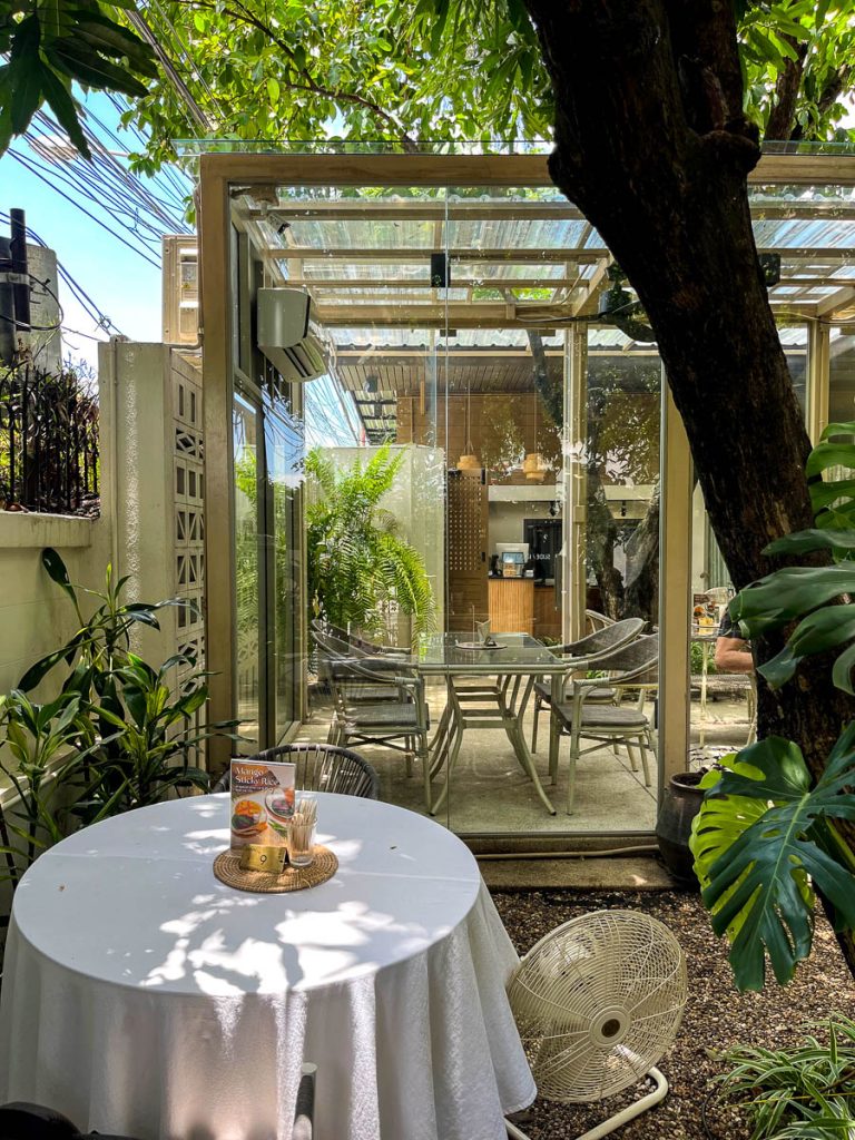 The best of both worlds at LANN Cafe — a cool glasshouse interior and dappled garden seating