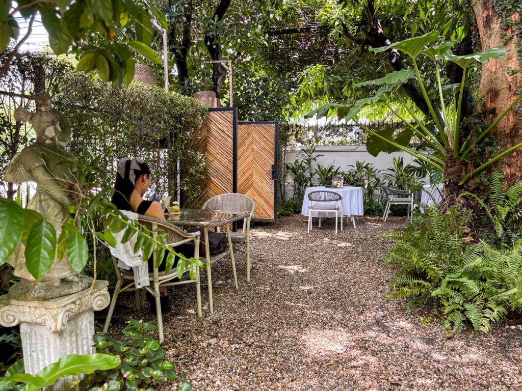 Woven chairs, dappled light, and a hush of greenery — the perfect pause from the moat’s bustle at LANN Cafe