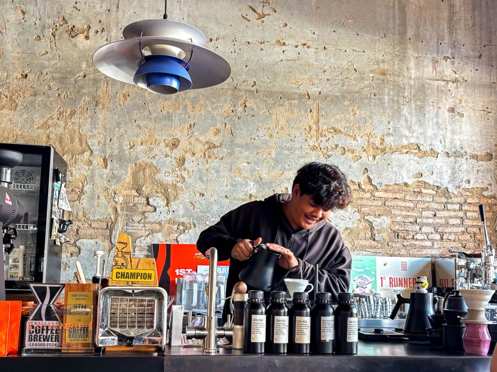Barista behind the bar at Flo Coffee Brewers, Chiang Mai, Thailand