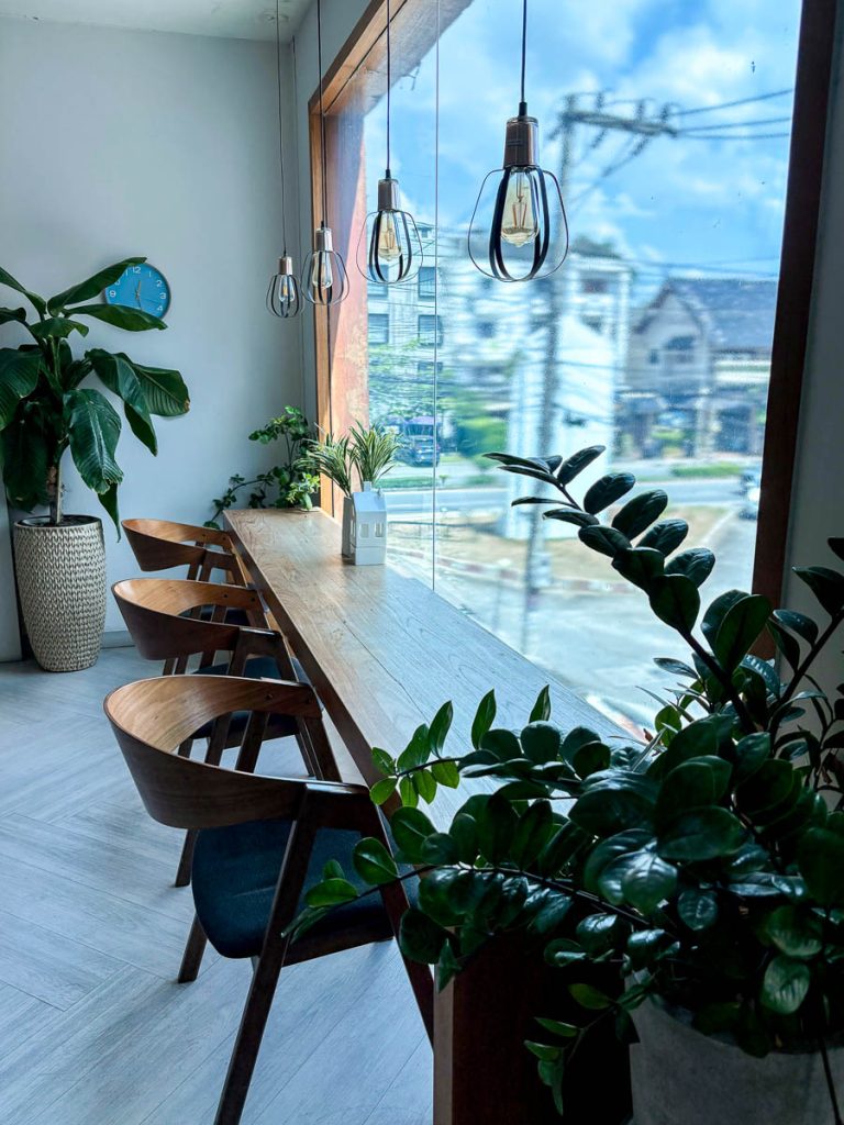 Bar-style counter seating by the window at Chapter One near Nimman