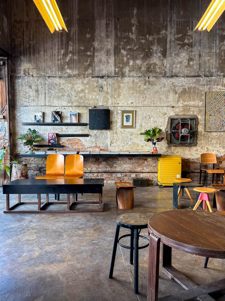 Raw concrete and brick interior of Flo Coffee Brewers cafe in San Pa Khoi, Chiang Mai