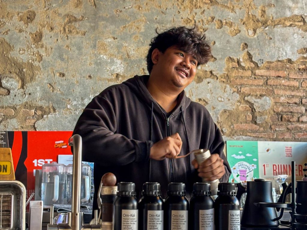 Barista preparing pour-over coffee at the slow bar at Flo Coffee Brewers in San Pa Khoi, Chiang Mai