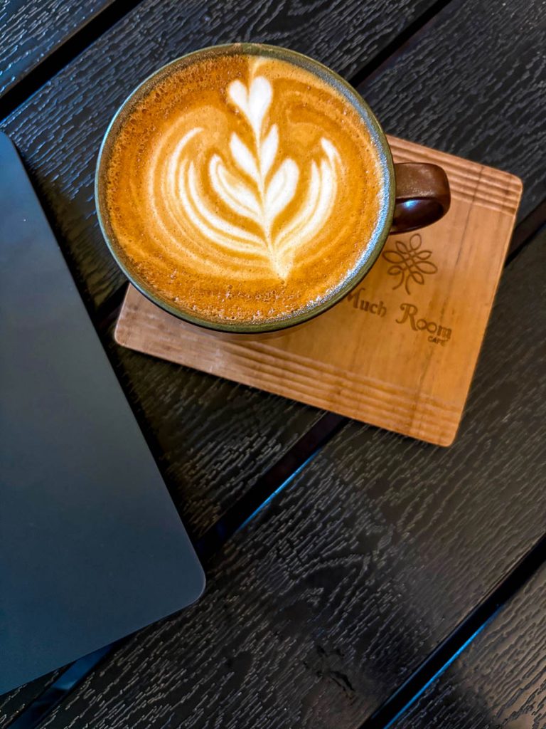 Hot latte with latte art at Much Room Cafe in Chiang Mai