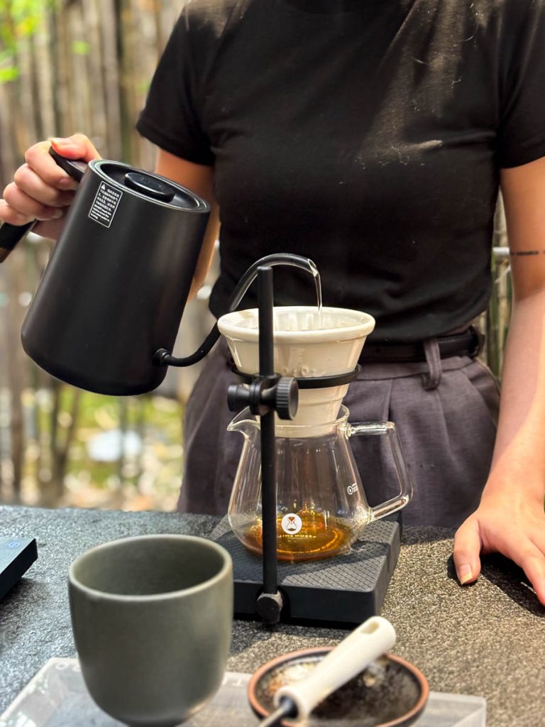 Close up of Barista preparing pour over coffee at Baristro Asian Style coffee slow bar Chiang Mai