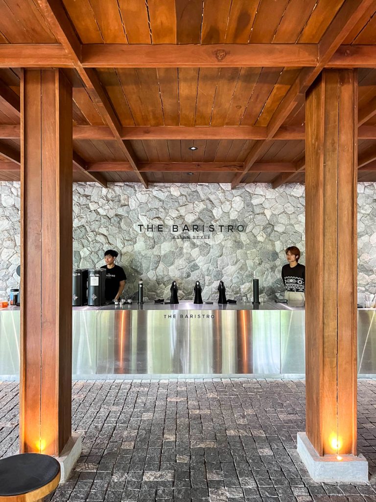 The Baristro Asian Style speed bar counter framed by timber columns and river stone wall Chiang Mai