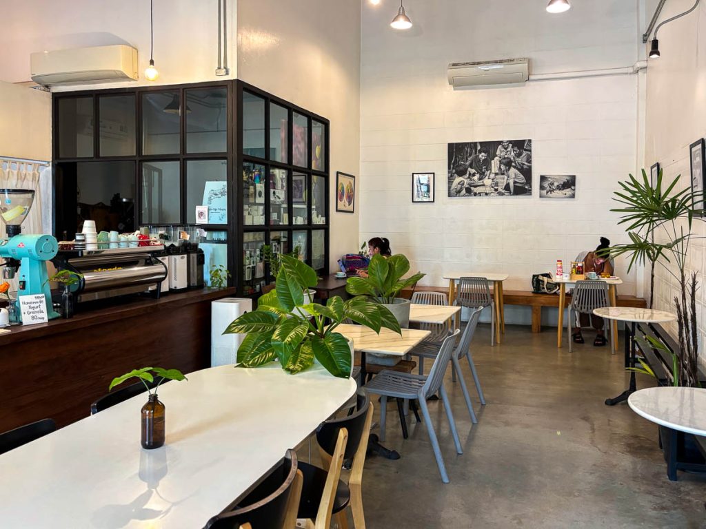 Interior of Cottontree Coffee Roasters cafe in Chang Phueak, Chiang Mai, with coffee bar and seating area