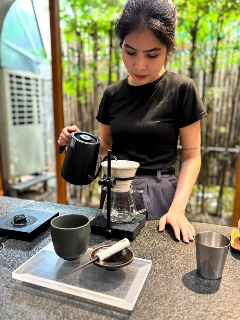Barista preparing pour over coffee at Baristro Asian Style coffee slow bar Chiang Mai