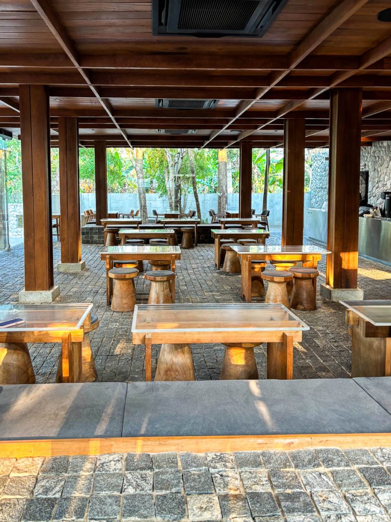 Baristro Asian Style Chiang Mai speed bar pavilion interior with wooden stools, stone floor and garden views