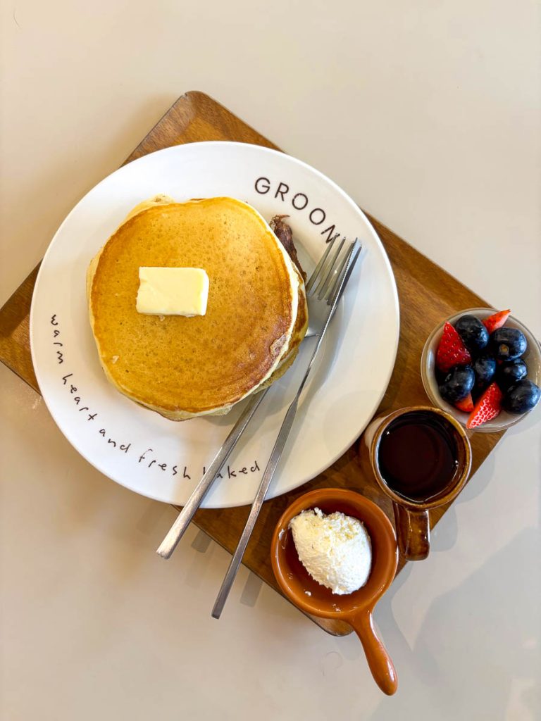 Granny's Pancake topped with seasonal berries, fresh cream, and maple syrup at GROON Bread & Brunch Cafe, Chiang Mai