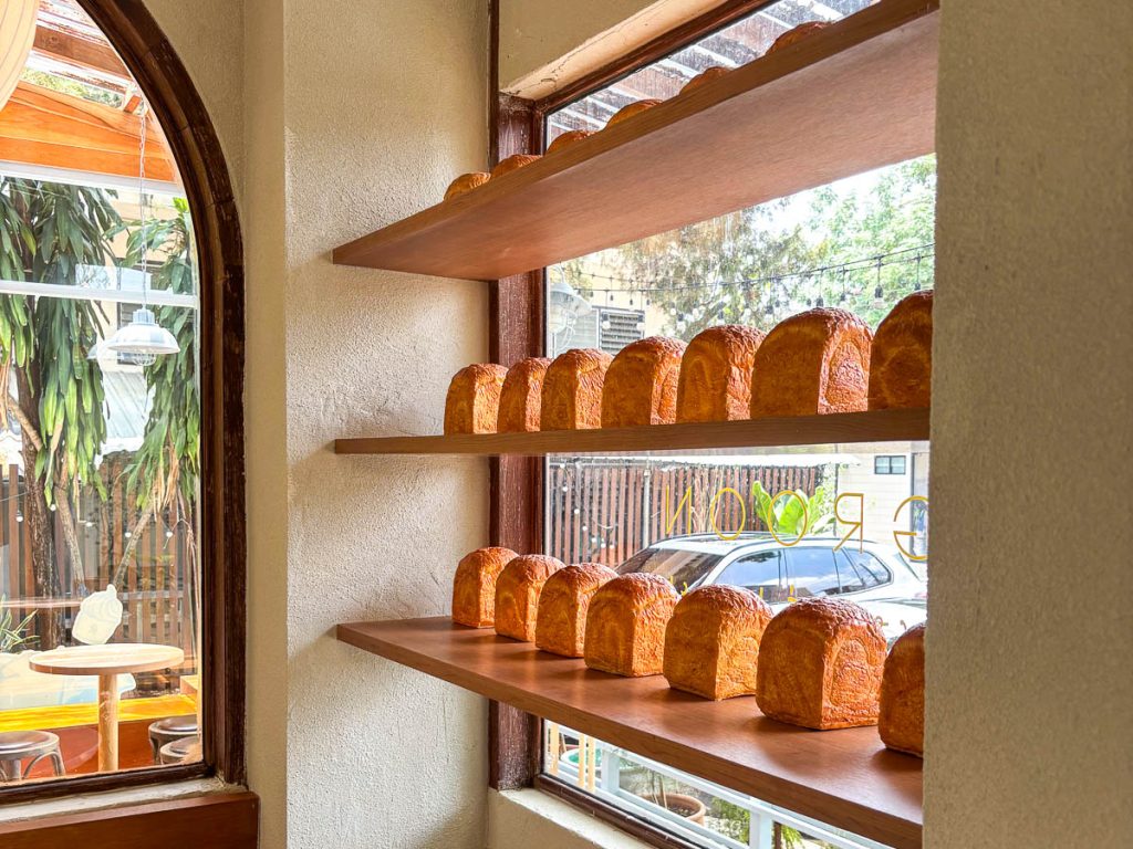 Decorative bread display inside GROON Bread & Brunch Cafe, highlighting the bakery-led atmosphere and artisan baking theme