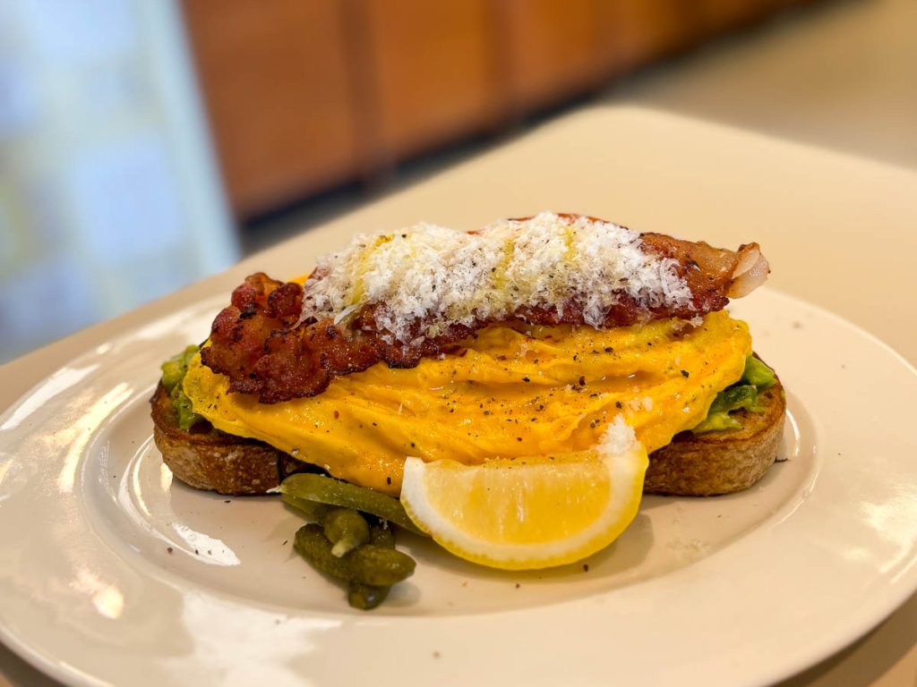 Bacon & Happy Eggs Open Toast served on house-made sourdough at GROON Bread & Brunch Cafe in Chiang Mai