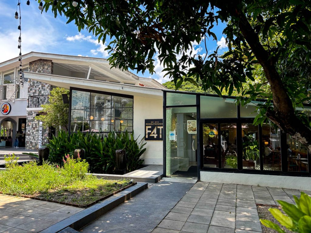 Food4Thought East cafe exterior with floor-to-ceiling windows and garden setting, Chiang Mai