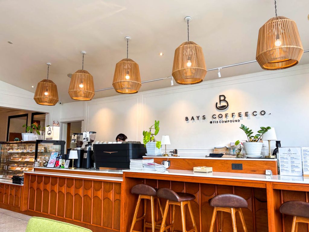Bays Coffee counter with woven pendant lights at 113 Compound, Chiang Mai