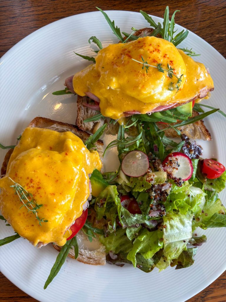 Eggs Benedict on sourdough with hollandaise and side salad at Food4Thought East, Chiang Mai